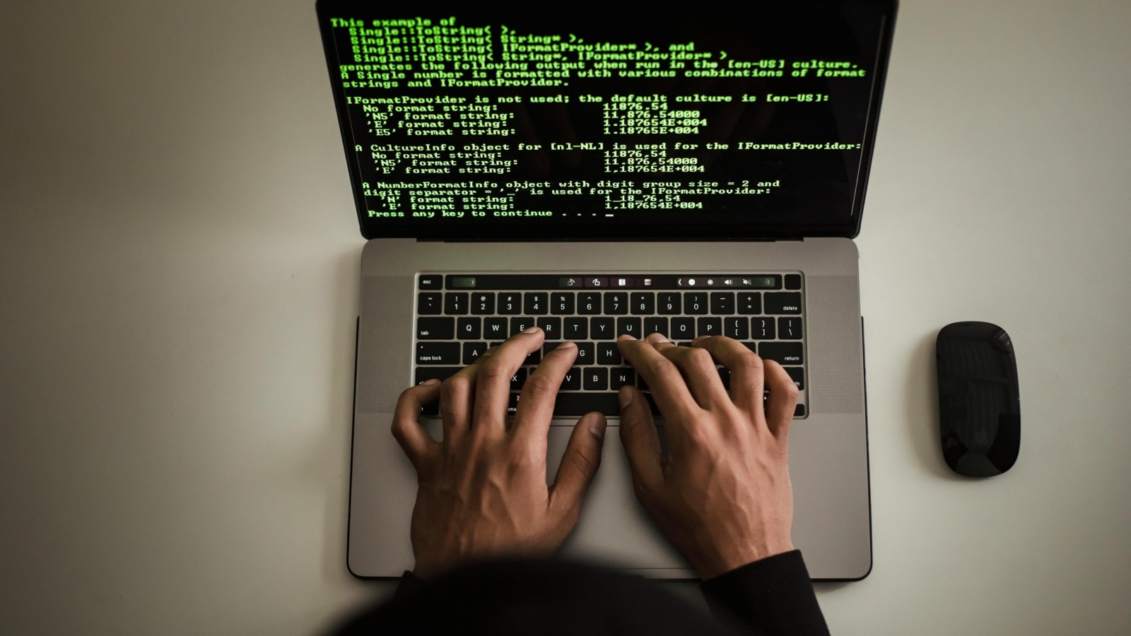 A man writing on laptop
