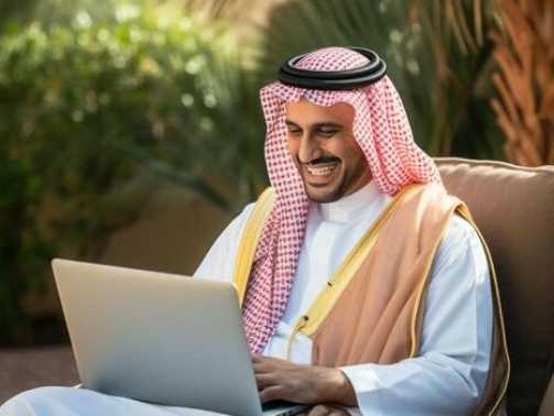 saudi-man-sitting-laptop-infront-having-an-online-meeting-generative-ai-photo