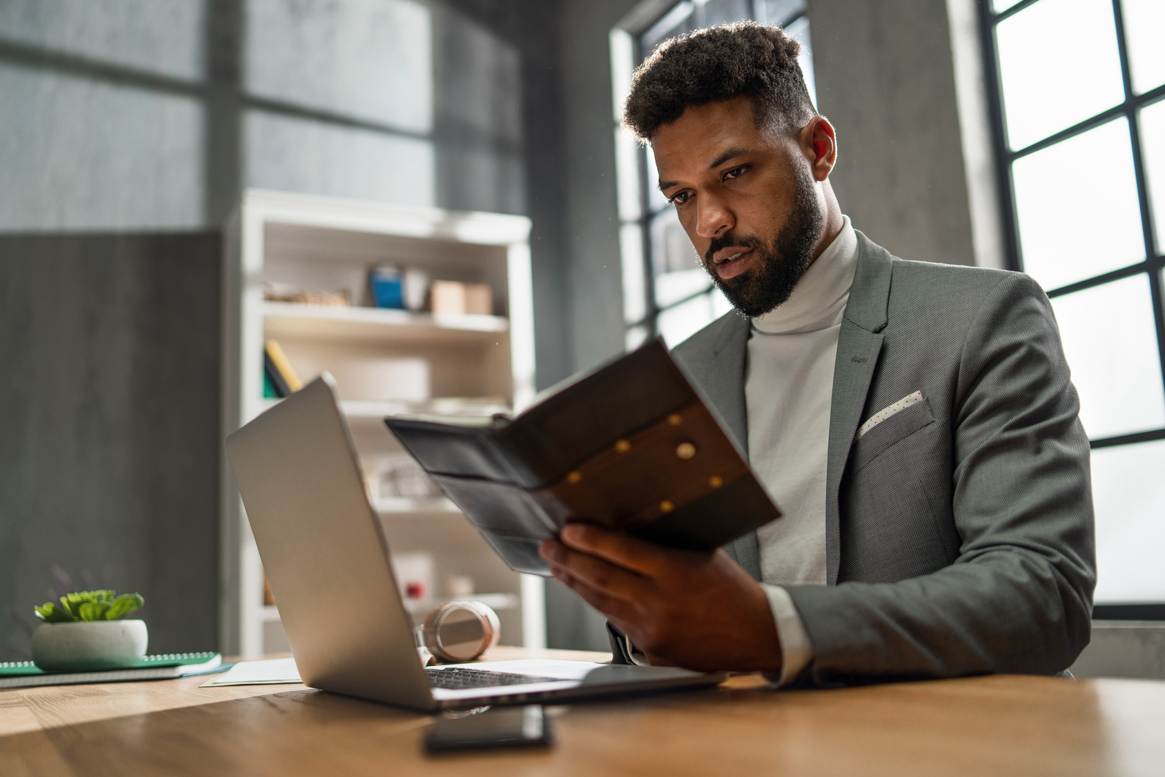 young-african-american-businessman-with-diary-work-2023-11-27-05-05-00-utc (1)